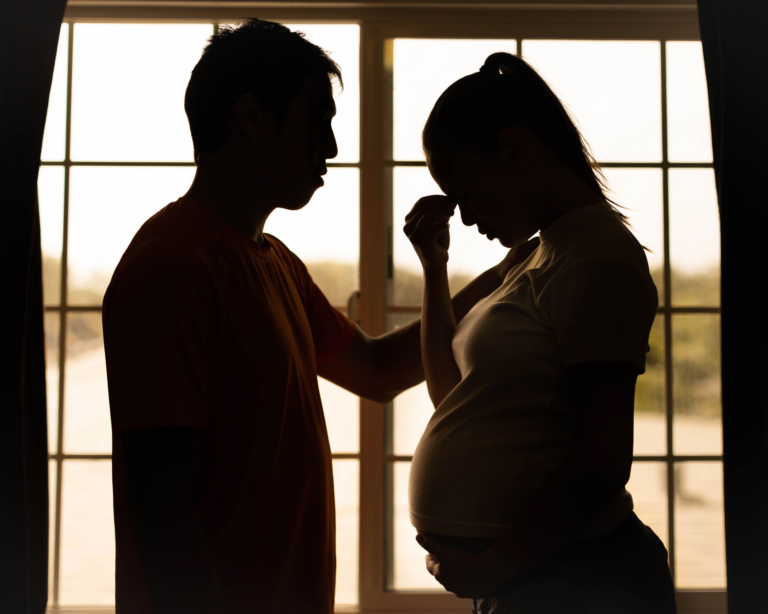 A couple stressed out and fighting during pregnancy