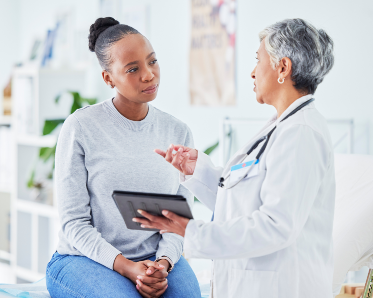 patient speaking to doctor at routine care visit