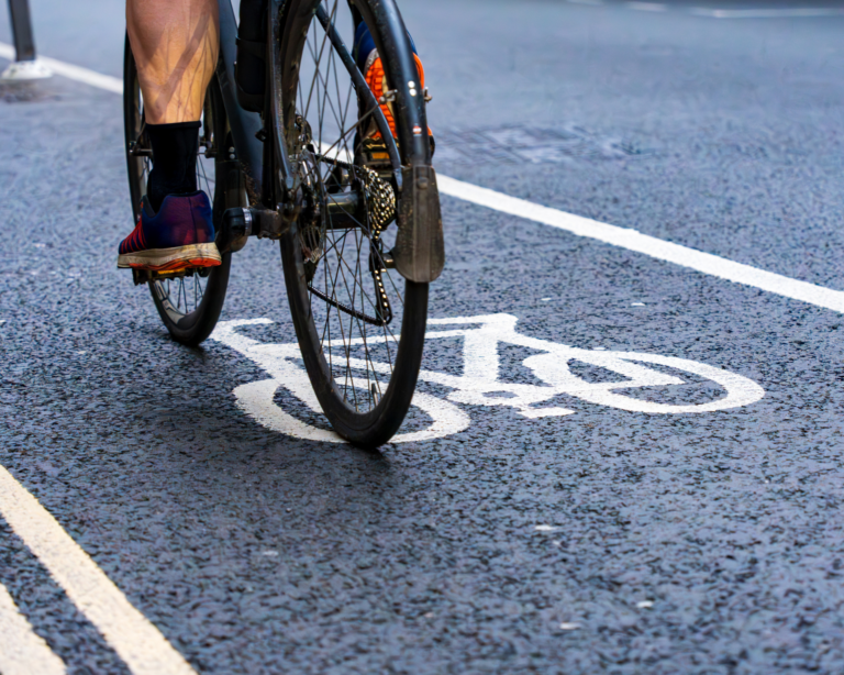 Cyclist riding in a bike lane in the city