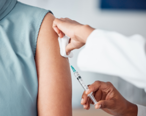 doctor giving patient a flu shot