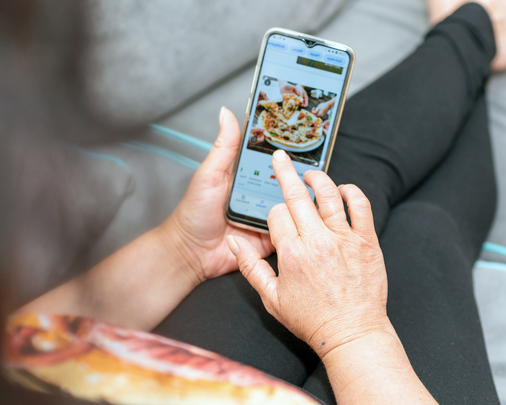 woman ordering dinner through a food delivery app