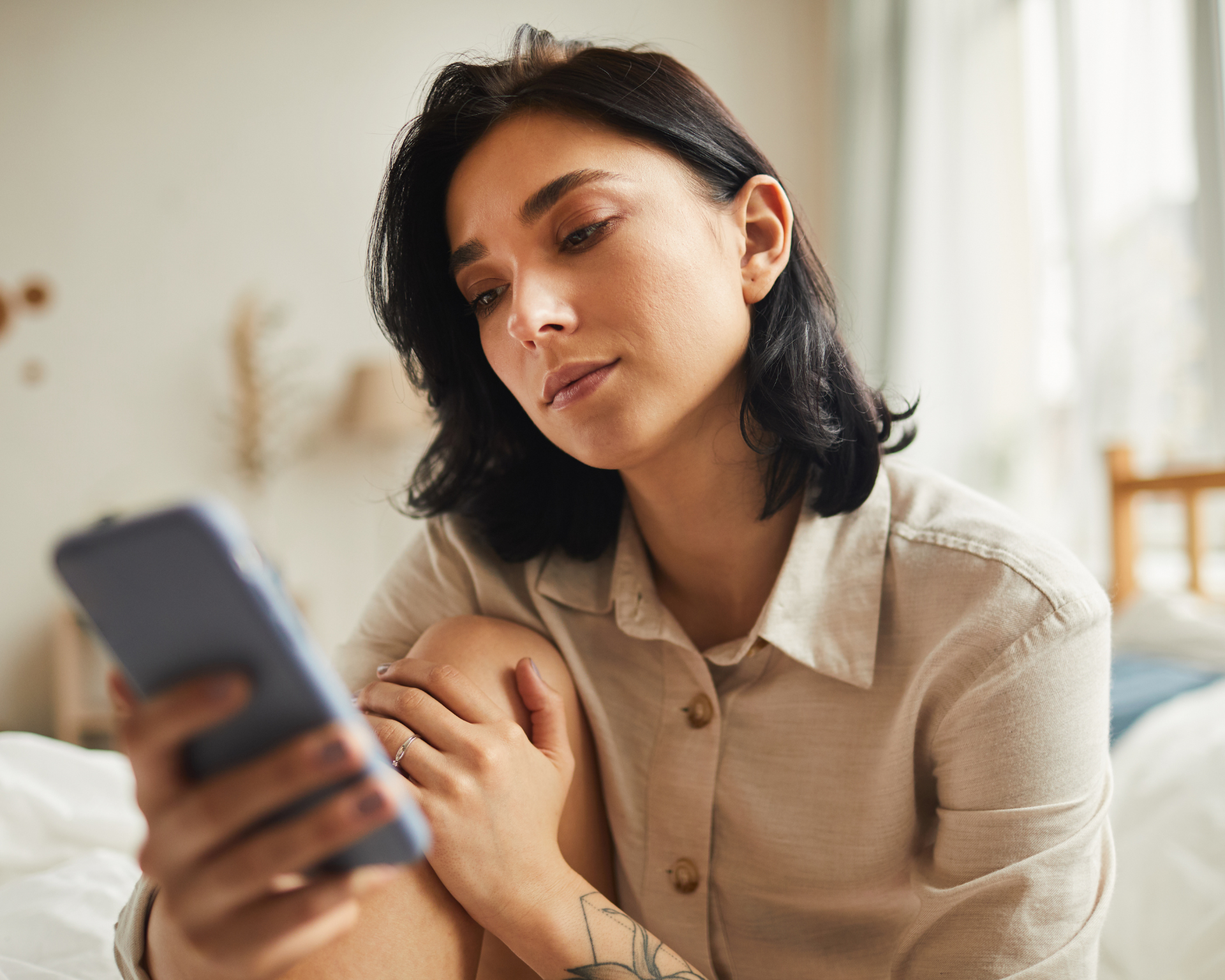 portrait of a young woman using a mobile app