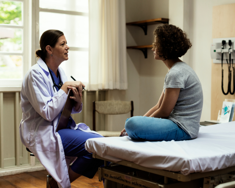 doctor talking with young, teenage patient. language barrier concept