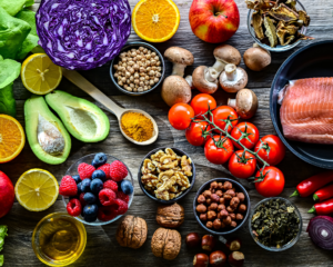 Flat-lay image of whole, healthy foods on a table