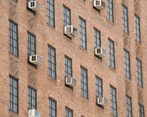 Exterior of urban building with windows and air conditioning units