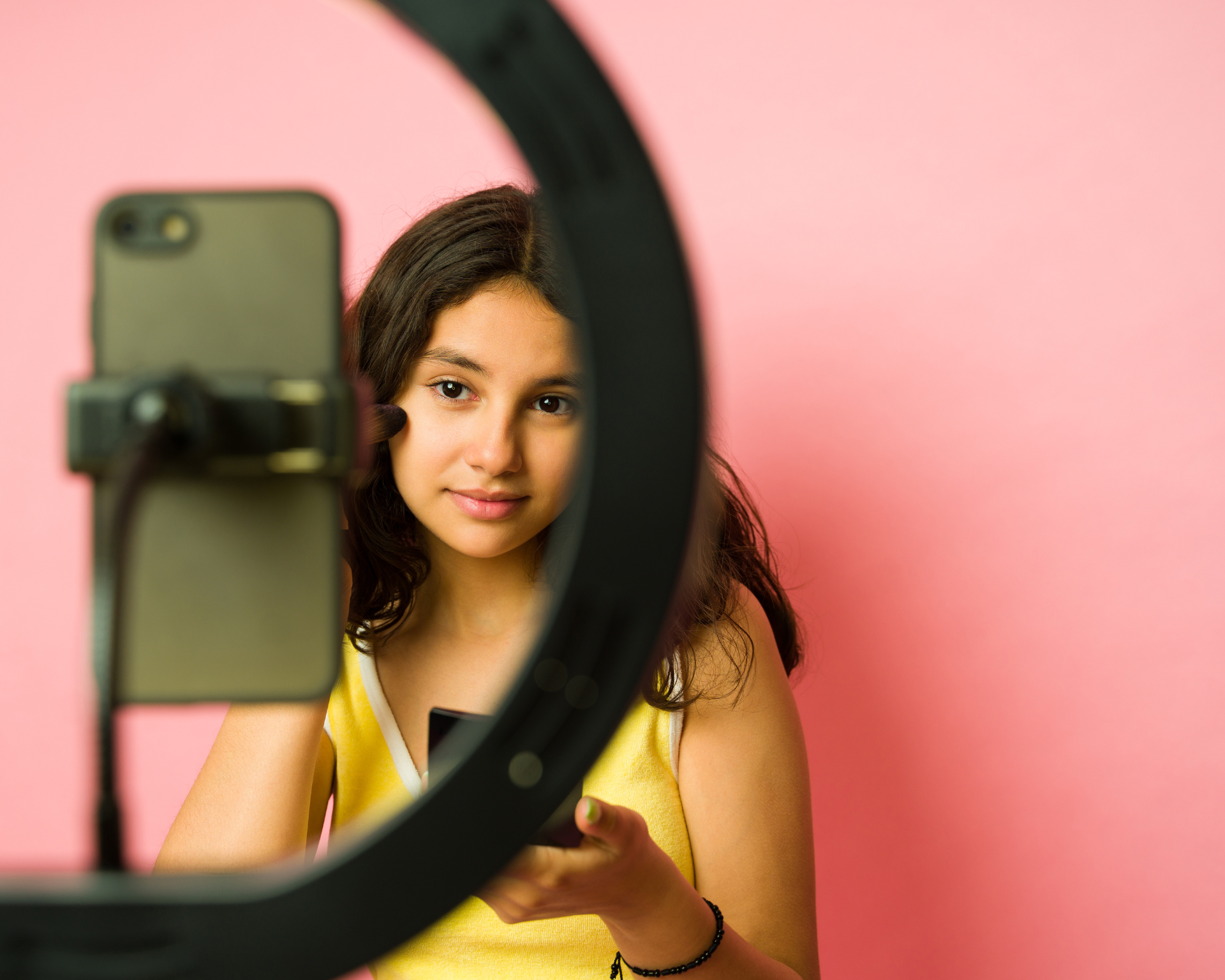 Young kidfluencer filming a video