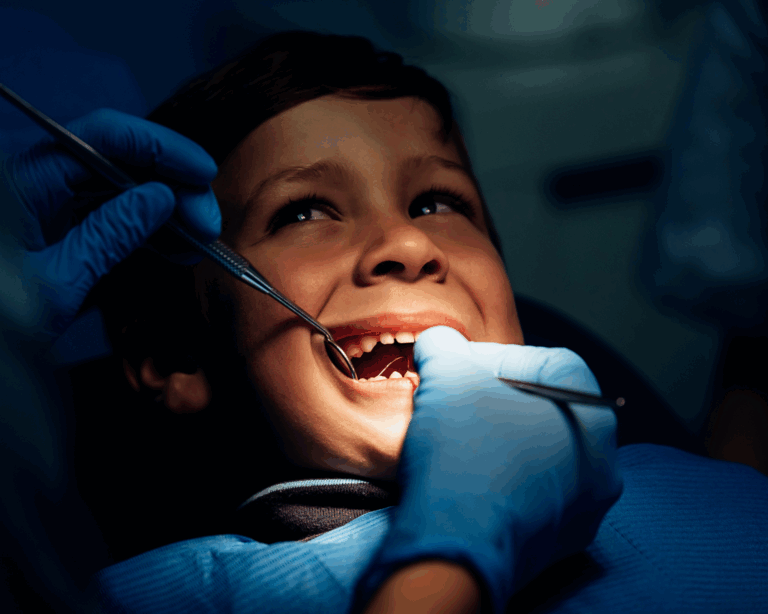 young boy getting dental work done