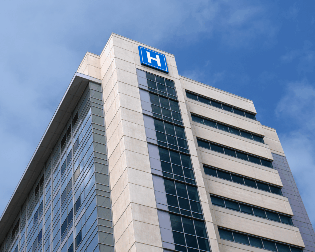 Building with a large H sign for "hospital"