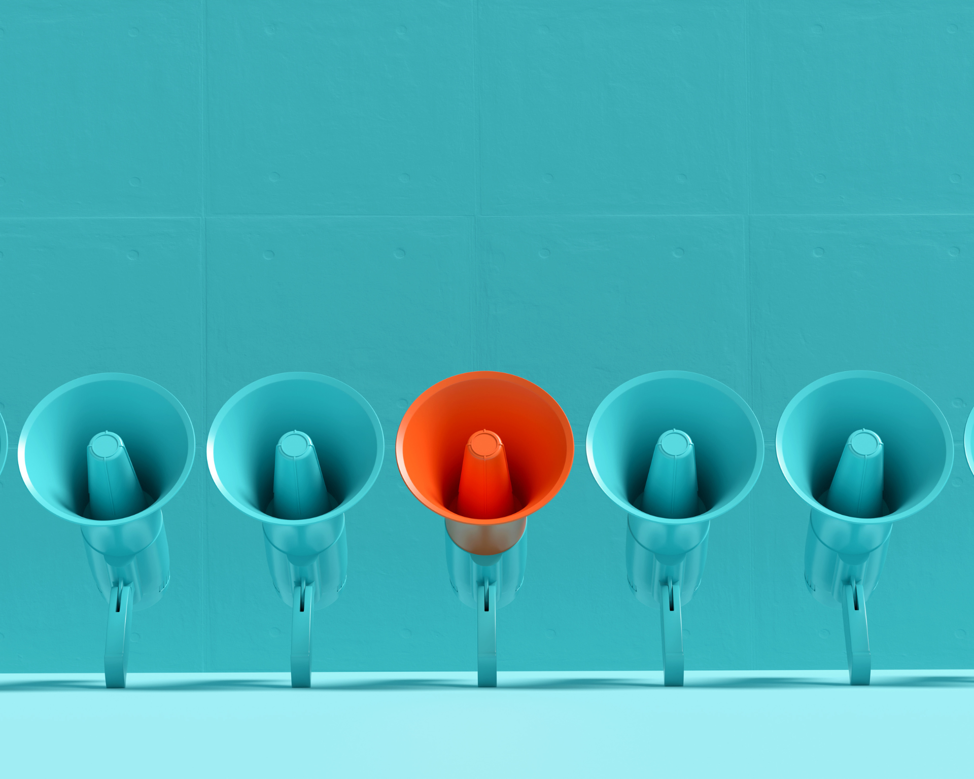 Blue megaphones in a row with one of them is in orange color on blue background. Concept of a differing message