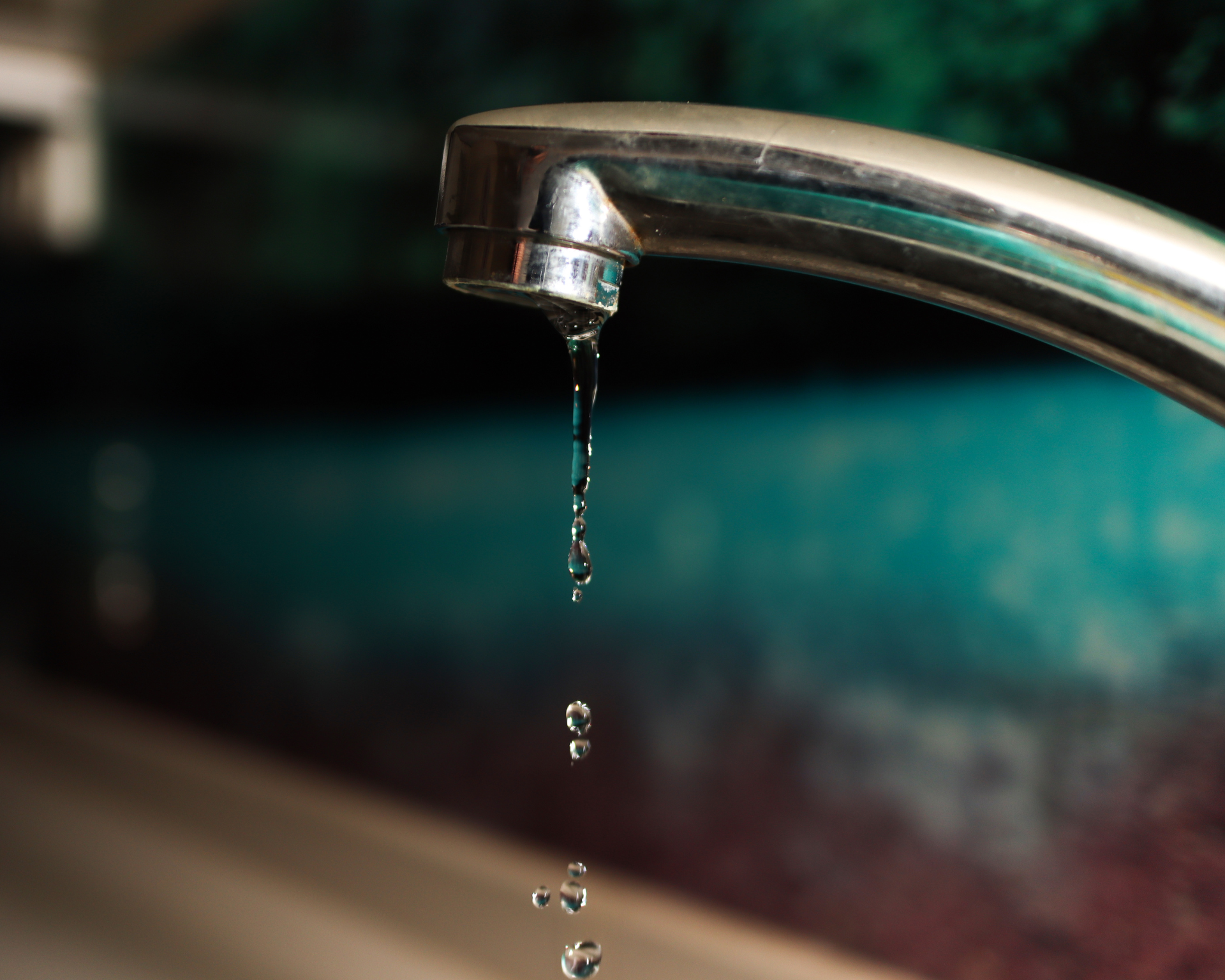 Slow Motion Flowing Water and Water Droplets and Close-up Tap