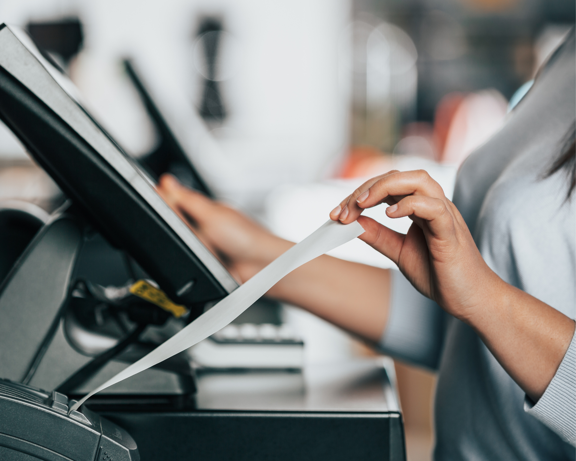 Woman printing a receipt for a customer