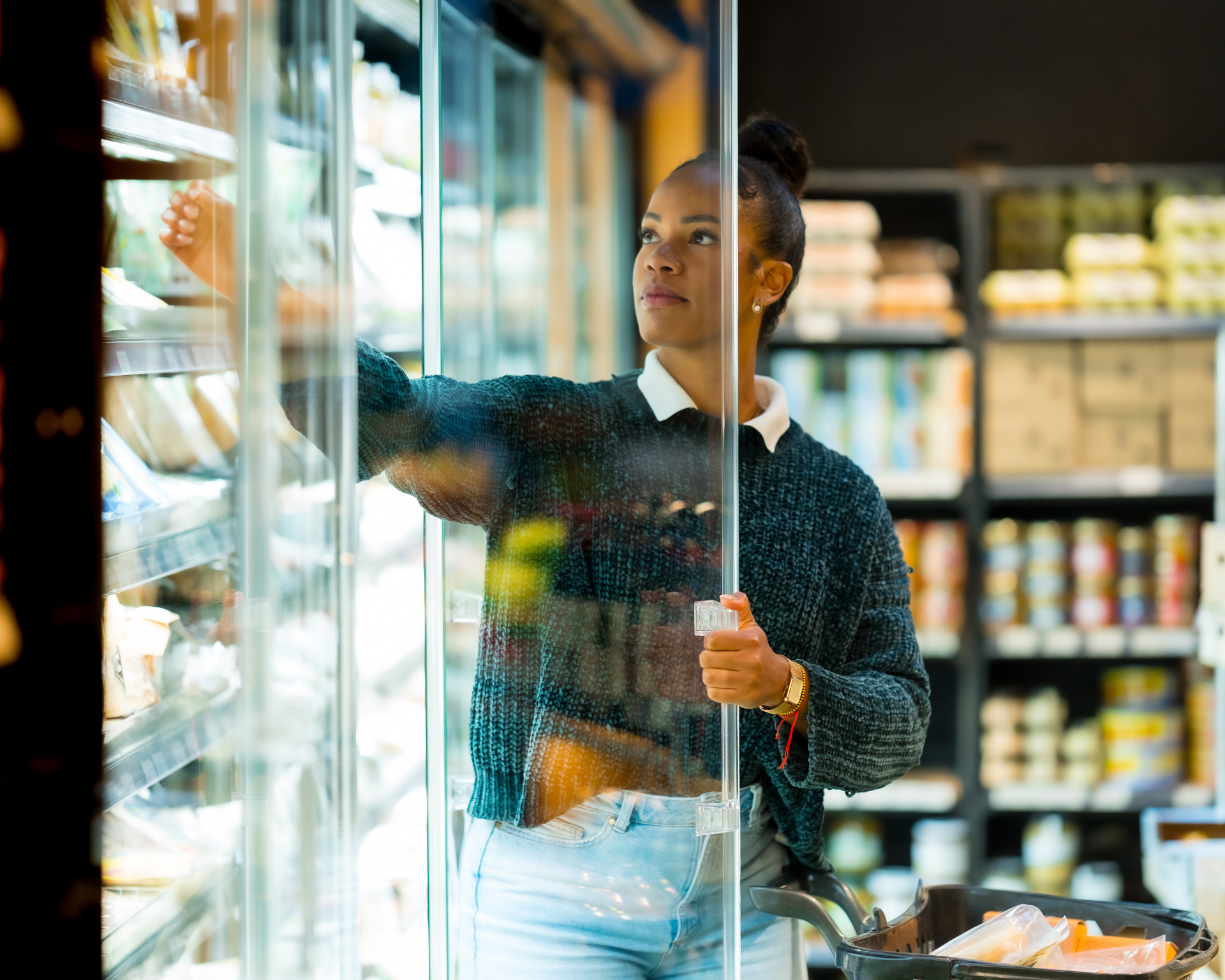 Portrait of a young woman grocery shopping. Hunger concept