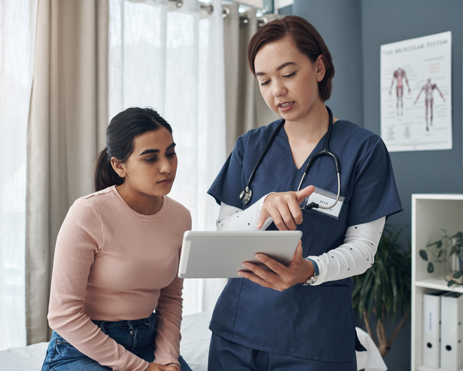 Portrait of a young female doctor talking to a patient in an office. Looking at iPad; AI language translation idea