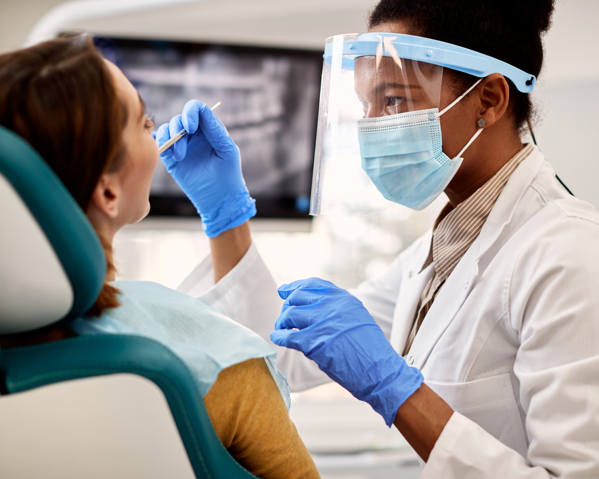 Dentist examining patient's teeth. Dental care concept