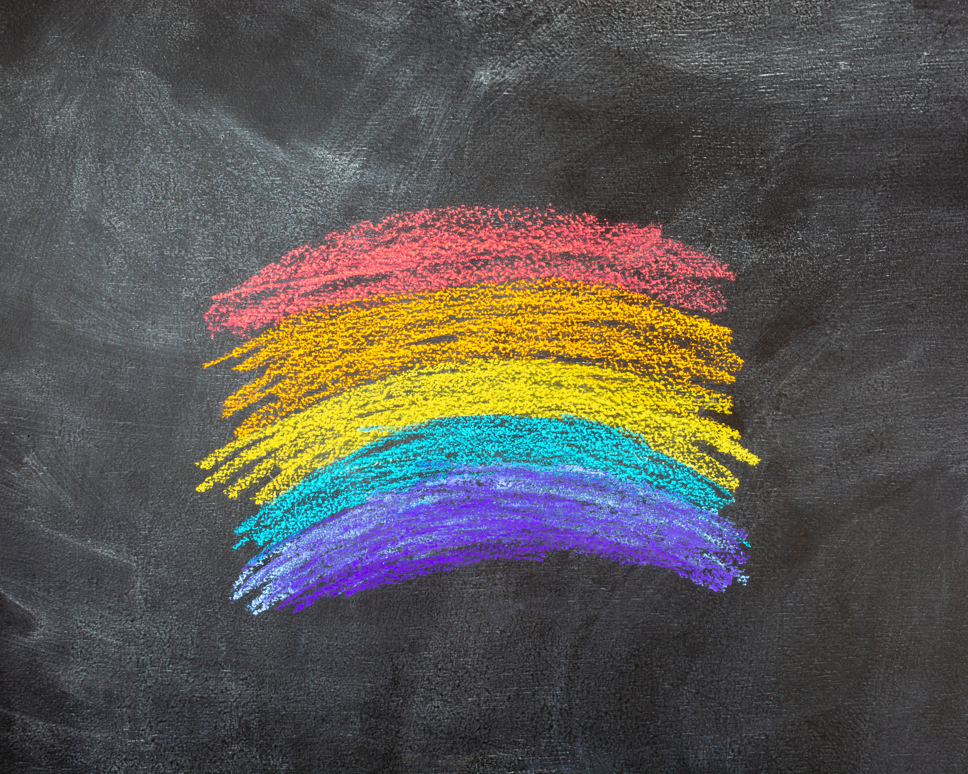 Pride flag drawn on a school chalk board
