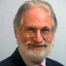 a man with a beard and glasses