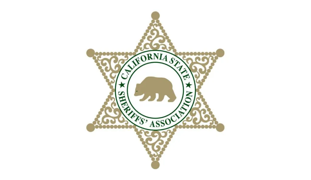 a star shaped badge with a bear