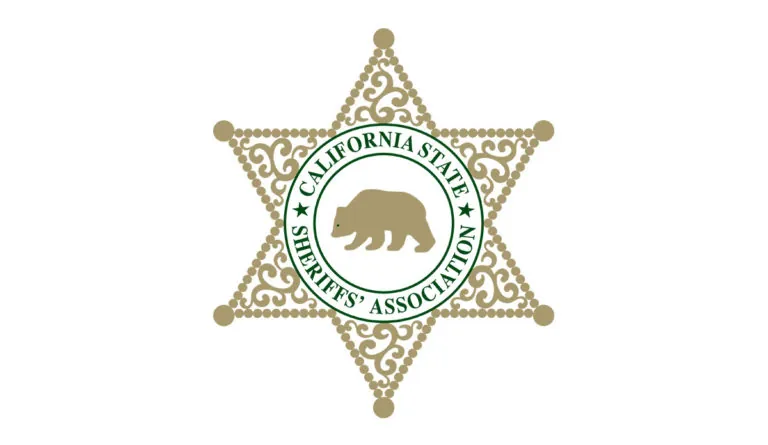 a star shaped badge with a bear