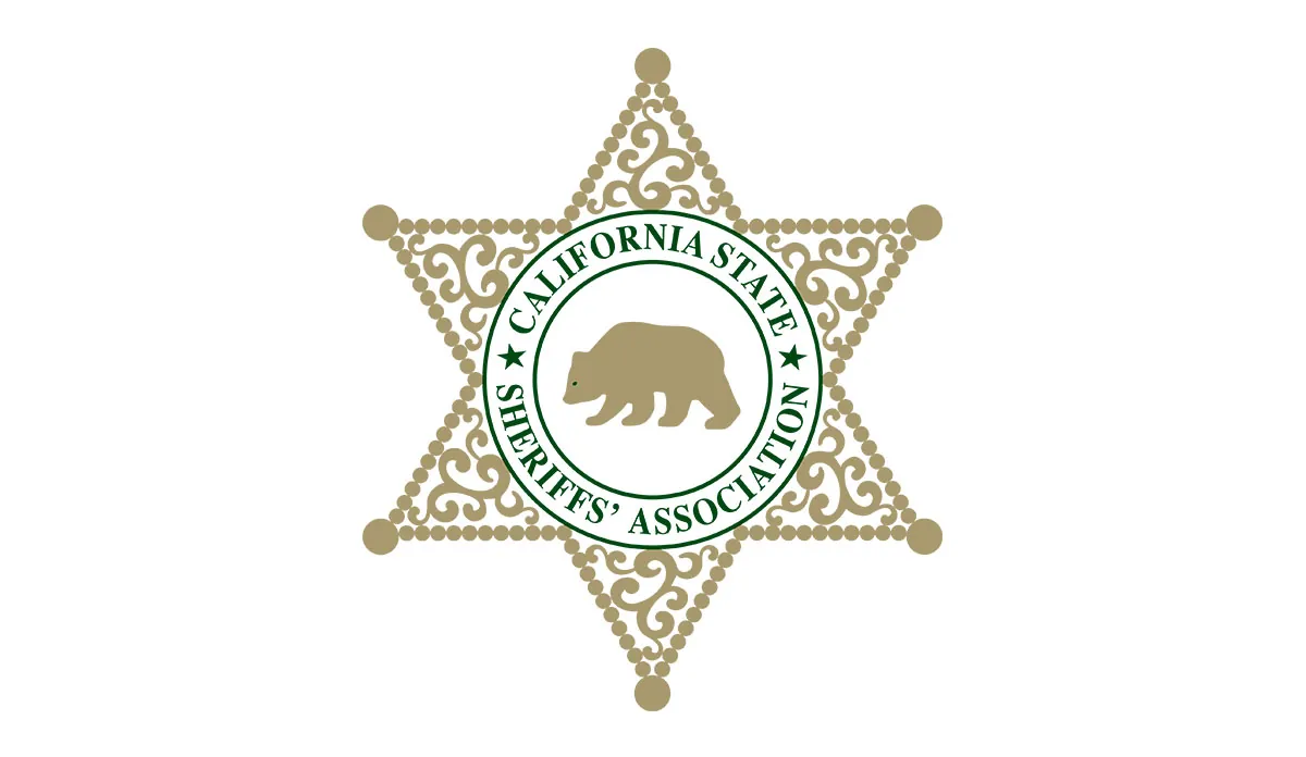 a star shaped badge with a bear