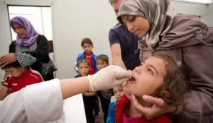 a woman holding a girl's mouth