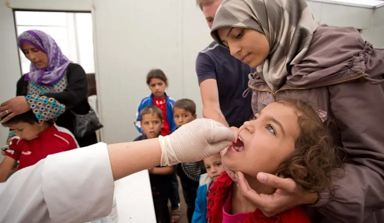 a woman holding a girl's mouth