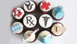 a group of cupcakes with medical symbols