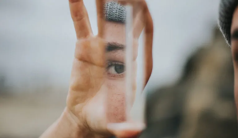 a hand holding a glass tube