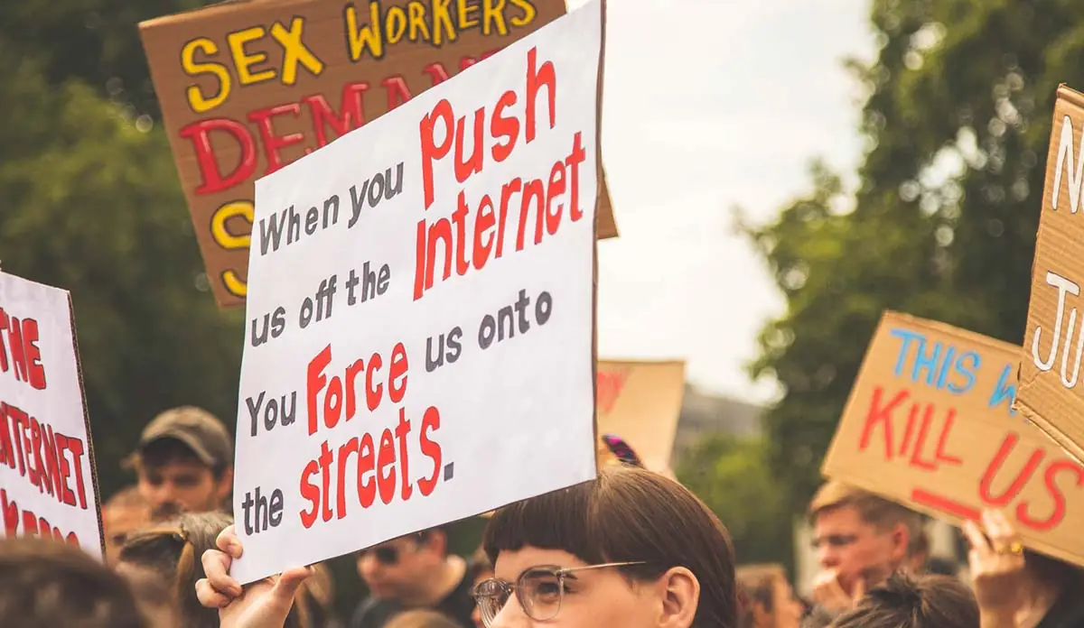 a person holding a sign