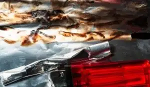 Heroin, a lighter, and a straw on tinfoil
