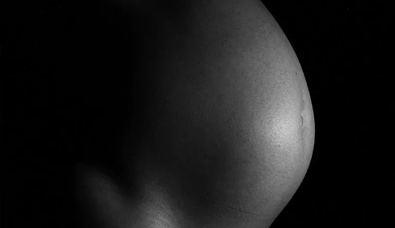 a close up of a pregnant woman's belly