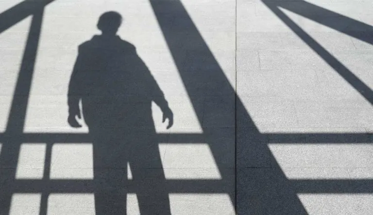 a shadow of a person on the ground
