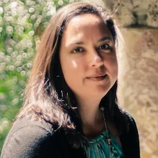 a woman with long hair and a blue shirt