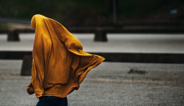 a person in a yellow cape