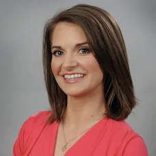 a woman in a pink shirt