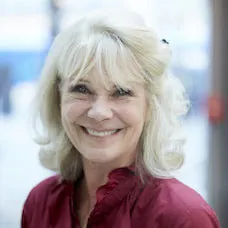 a close-up of a woman smiling
