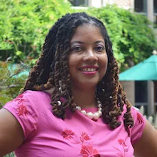 a woman in a pink shirt