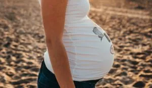 a close up of a pregnant woman's belly