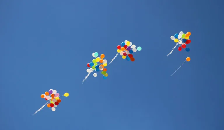 a group of balloons in the sky