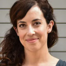 a woman smiling for a picture