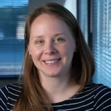 a woman smiling at camera