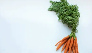 a bunch of carrots with leaves