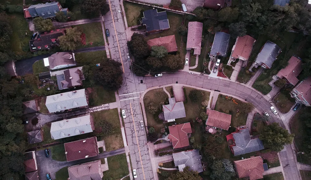 aerial view of a street and houses