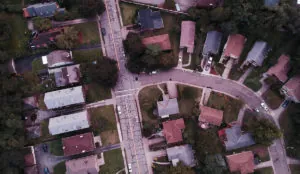 aerial view of a street and houses