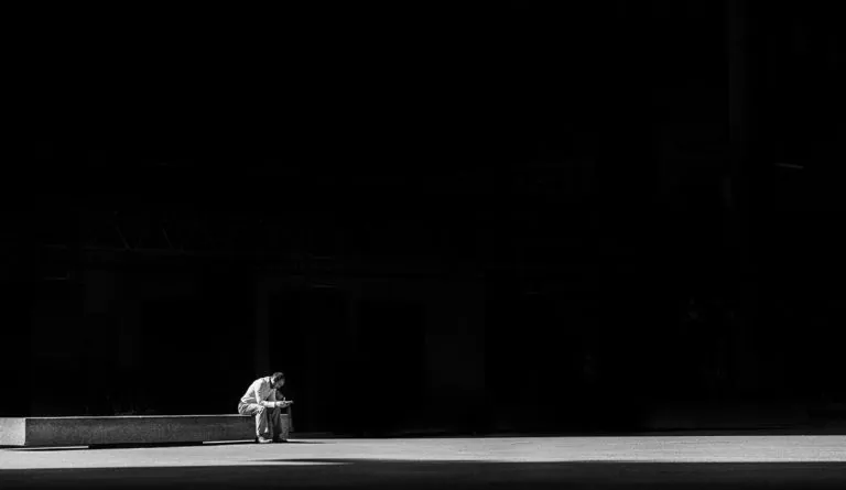 a man sitting on a bench