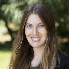 a woman smiling at camera