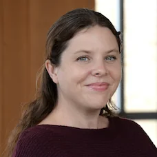 a woman smiling at the camera