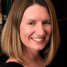 a woman smiling at the camera