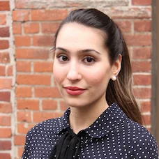 a woman in a polka dot shirt