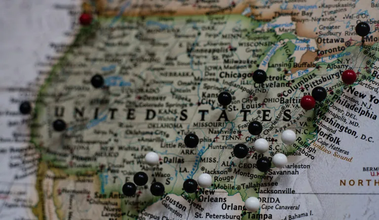 a map with a group of black and white pins