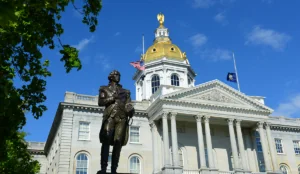 a statue of a man in front of a white building